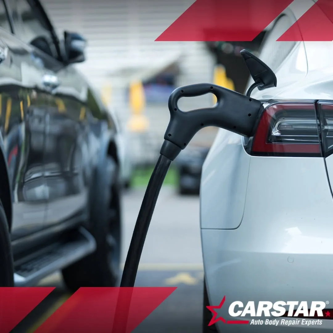 A white Tesla plugged into a charger at a charging station